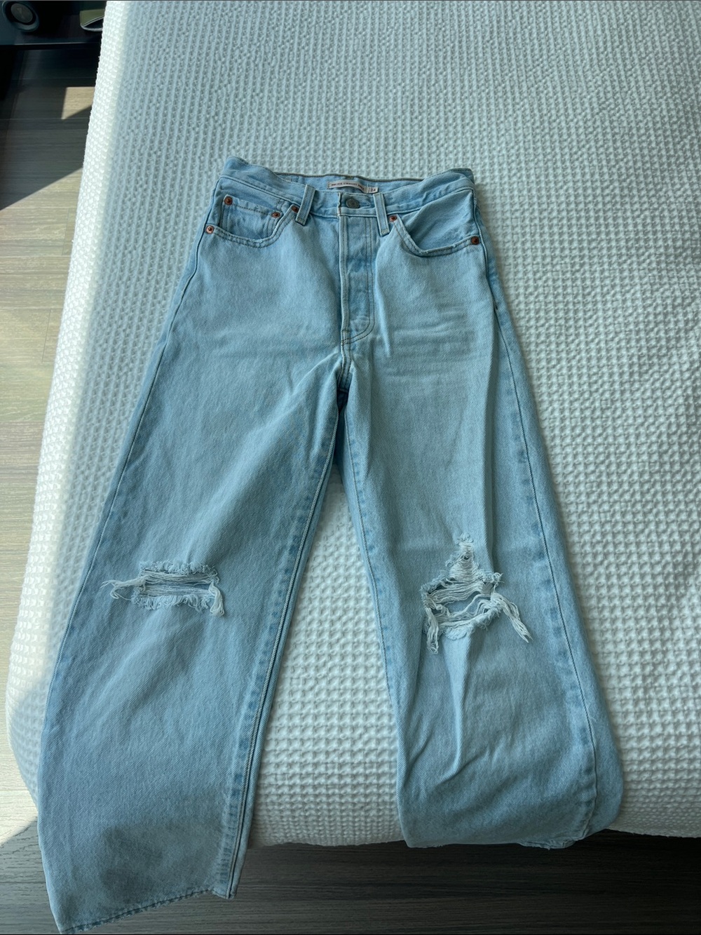 Levi’s Light Wash Distressed Wide-Leg Jeans